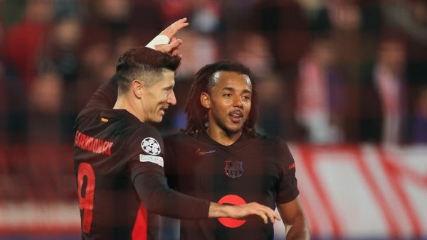 Barcelona's Polish forward #09 Robert Lewandowski (L) celebrates with teammates after scoring a goal during the UEFA Champions League, League phase - Matchday 4 football match between Crvena Zvezda Beograd and FC Barcelona, at the Rajko-Mitic Stadium, in Belgrade, on November 6, 2024. (Photo by Pedja Milosavljevic / AFP)