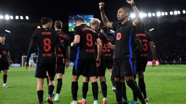 Barcelona's Brazilian forward #11 Raphinha celebrates scoring his team's first goal during the Spanish league football match between RC Celta de Vigo and FC Barcelona at the Balaidos stadium in Vigo on November 23, 2024. (Photo by MIGUEL RIOPA / AFP)