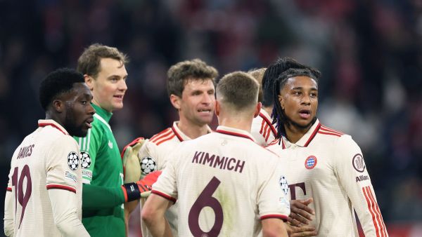 Bayern Munich's French midfielder #17 Michael Olise (R) and Bayern Munich's German goalkeeper #01 Manuel Neuer (2nd L) celebrate wqith teammates after winning the UEFA Champions League, League phase - Matchday 5, football match between FC Bayern Munich Paris Saint-Germain (PSG) in Munich, southern Germany, on November 26, 2024. (Photo by FRANCK FIFE / AFP)