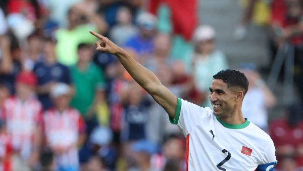 Morocco's defender #02 Achraf Hakimi celebrates scoring his team's sixth goal in the men's bronze medal football match between Egypt and Morocco during the Paris 2024 Olympic Games at the La Beaujoire Stadium in Nantes on August 8, 2024. (Photo by Alain JOCARD / AFP)