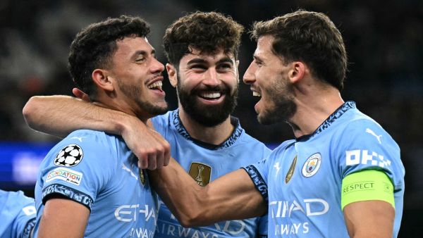 Manchester City's Portuguese midfielder #27 Matheus Nunes (L) celebrates scoring the team's fifth goal with Manchester City's Croatian defender #24 Josko Gvardiol (C) and Manchester City's Portuguese defender #03 Ruben Dias during the UEFA Champions League football match between Manchester City and Sparta Prague at the Etihad Stadium in Manchester, north west England, on October 23, 2024.h west England, on October 23, 2024. (Photo by Oli SCARFF / AFP)