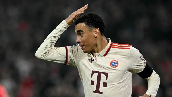Bayern Munich's German midfielder #42 Jamal Musiala celebrates after scoring the 1-0 opening goal during the UEFA Champions League football match FC Bayern Munich vs SL Benfica in Munich, southern Germany, on November 6, 2024. (Photo by Tobias SCHWARZ / AFP)
