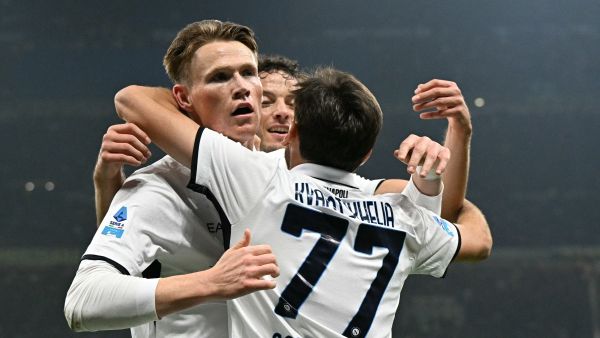 Napoli's Scottish midfielder #08 Scott Mc Tominay celebrates scoring his team's first goal with Napoli's Georgian forward #77 Khvicha Kvaratskhelia during the Italian Serie A football match between Inter Milan and Napoli at San Siro stadium in Milan, on November 10, 2023. (Photo by Gabriel BOUYS / AFP)
