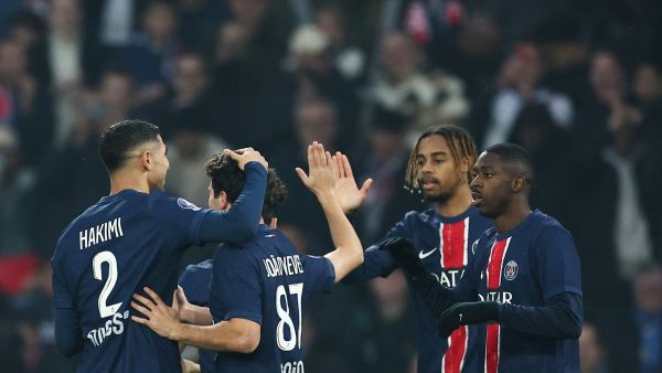 Paris Saint-Germain's French forward #10 Ousmane Dembele (R) celebrates after opening the scoring next to Paris Saint-Germain's French forward #29 Bradley Barcola during the French L1 football match between Paris Saint-Germain (PSG) and RC Lens (RCL) at The Parc des Princes Stadium in Paris on November 2, 2024. (Photo by FRANCK FIFE / AFP)