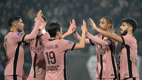 Paris Saint-Germain's French forward #29 Bradley Barcola (2-R) celebrates scoring his team's fourth goal with teammates during the French L1 football match between SCO Angers and Paris Saint-Germain (PSG) at The Raymond-Kopa Stadium in Angers, western France, on November 9, 2024. (Photo by Damien MEYER / AFP)