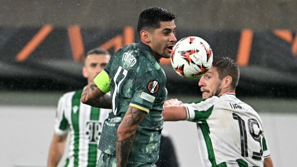 Ferencváros' Hungarian forward #19 Barnabas Varga (R) and Tottenham Hotspur's Argentinian defender #17 Cristian Romero vie for the ball during the UEFA Europa League football match between Ferencvarosi TC and Tottenham Hotspur in Budapest on October 3, 2024. (Photo by Attila KISBENEDEK / AFP)
