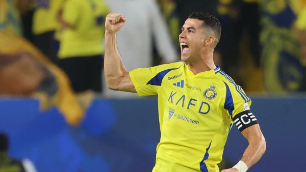 Nassr's Portuguese forward #7 Cristiano Ronaldo celebrates scoring his team's first goal during the Saudi Pro League football match between Al-Nassr and Al-Qadsiah at Al-Awwal Park in Riyadh on November 22, 2024. (Photo by Fayez NURELDINE / AFP)