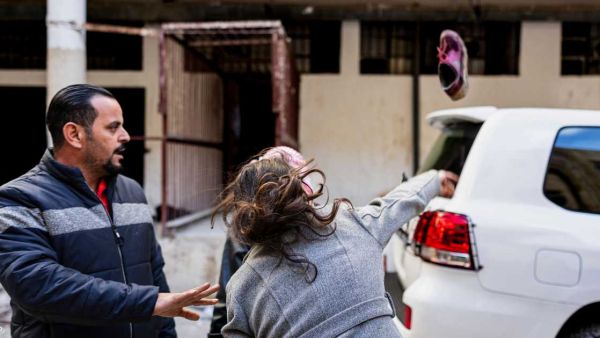 Syrian woman throws shoe at UN convoy near Saydnaya prison