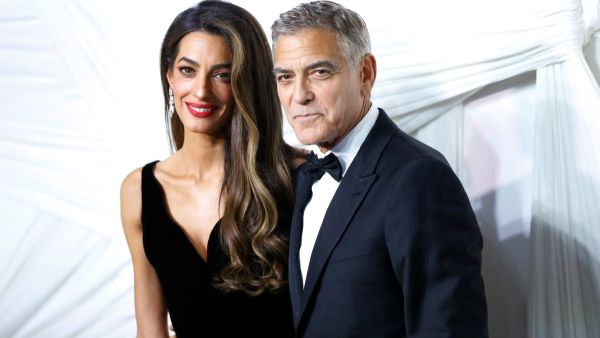 US actor George Clooney (R) and his wife Lebanese-British barrister Amal Clooney arrive for "The Albies" hosted by the Clooney Foundation for Justice at the New York Public Library in New York, September 26, 2024. The Albies is the Clooney Foundation for Justice's annual event honoring courageous defenders of justice. The event is named in honor of Justice Albie Sachs, who is revered for his heroic commitment to ending apartheid. (Photo by John Lamparski / AFP) George Clooney and Amal Clooney
