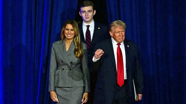 Donald Trump (R) arrives for an election night event alongside former US First Lady Melania Trump and his son Barron Trump at the West Palm Beach Convention Center in West Palm Beach, Florida, on November 6, 2024. (Photo by Jim WATSON / AFP) Barron Trump, Donald Trump