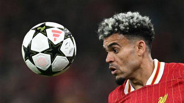 Liverpool's Colombian midfielder #07 Luis Diaz headers the ballduring the UEFA Champions League league stage football match between Liverpool and Bologna at Anfield in Liverpool, north west England on October 2, 2024. (Photo by Paul ELLIS / AFP)