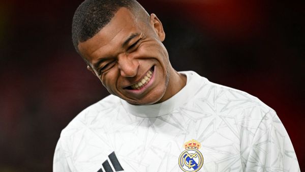Real Madrid's French forward #09 Kylian Mbappe reacts during the warm up ahead of the UEFA Champions League football match between Liverpool and Real Madrid at Anfield in Liverpool, north west England on November 27, 2024. (Photo by Oli SCARFF / AFP)