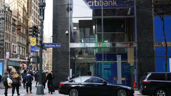 People walk past a Citibank on 42nd Street