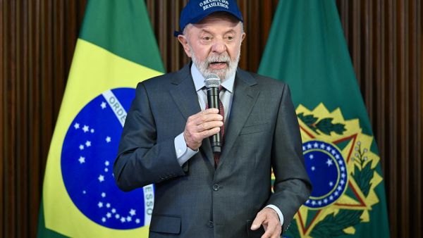 Brazil's President Luiz Inacio Lula da Silva speaks wearing a cap reading "Brazil belongs to Brazilians" during a ministerial meeting at the Planalto Palace in Brasilia on August 26, 2025. AFP Lula slams U.S. over visa revocation of Justice Minister, calls move “Irresponsible”