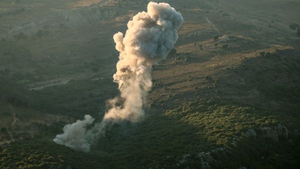 A plume of smoke rises above hills after an Israeli strike in the southern Lebanese Jezzine district on June 20, 2025. Photo by Rabih DAHER / AFP hezbollah
