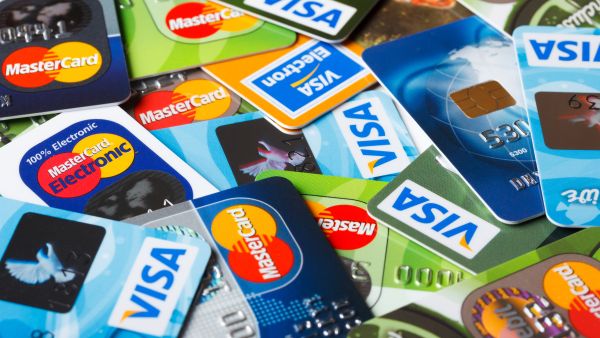 Banknotes with Magnifying Glass and Calculator. President Bashar al Assad portrrait is in focused in the magnifying glass