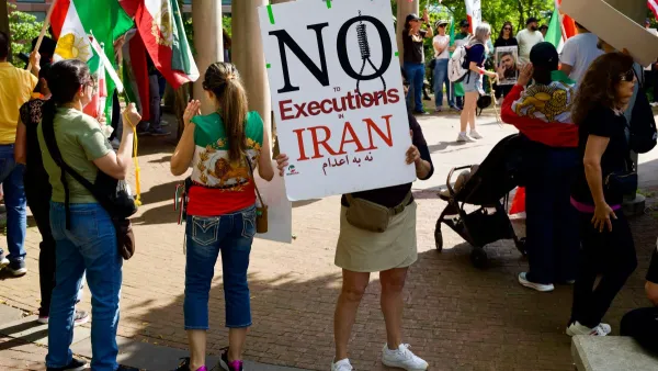 Woman holds a sign