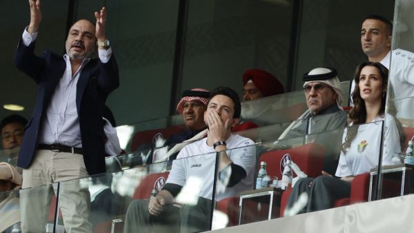 Jordanian crown prince Hussein and his uncle Prince Ali watching Jordan's football team play