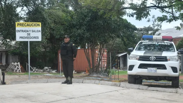 Policeman standing guard outside the hospital where Beller lies.