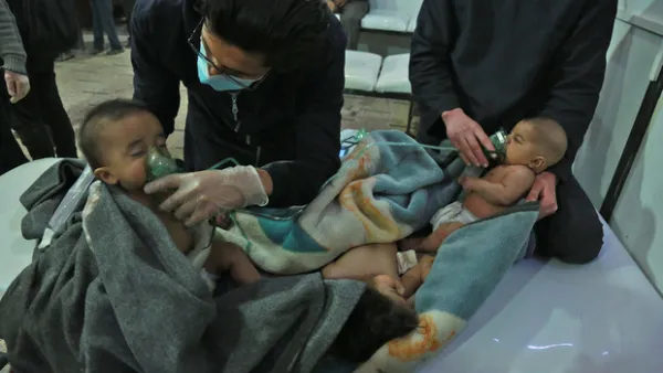 Syrian babies receive treatment for a suspected chemical attack at a makeshift clinic on the rebel-held village of al-Shifuniyah in the Eastern Ghouta region on the outskirts of the capital Damascus (AFP)