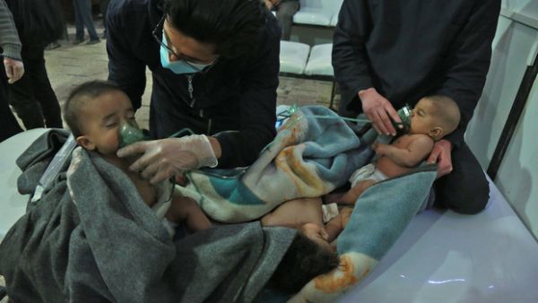 Syrian babies receive treatment for a suspected chemical attack at a makeshift clinic on the rebel-held village of al-Shifuniyah in the Eastern Ghouta region on the outskirts of the capital Damascus (AFP)