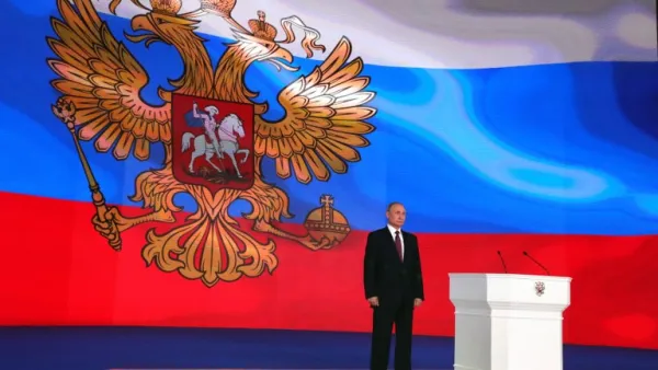 Russian President Vladimir Putin stands on the stage while addressing the Federal Assembly at Moscow's Manezh exhibition centre on Mar. 01, 2018. 
(Mikhail KLIMENTYEV / SPUTNIK / AFP)