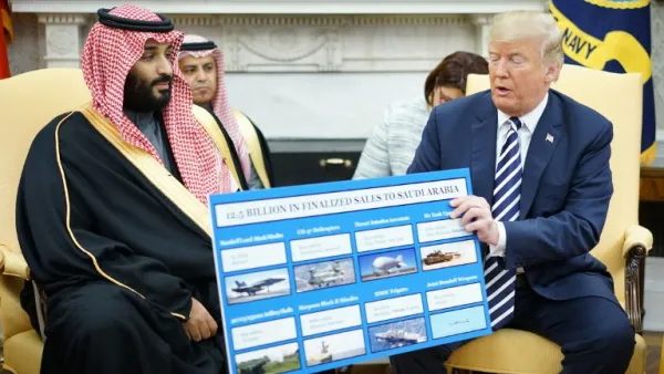 U.S. President Donald Trump (R) holds a defence sales chart with Saudi Arabia's Crown Prince Mohammed bin Salman in the Oval Office of the White House on Mar. 20, 2018 in Washington, DC. 
(MANDEL NGAN / AFP)