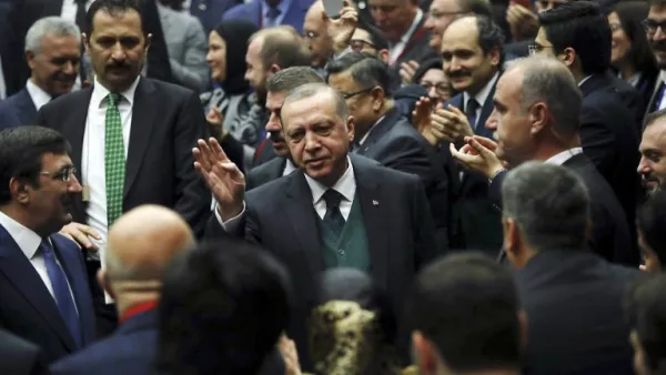 Turkish President Recep Tayyip Erdogan (C) greets the crowd during Turkey's ruling Justice and Development (AK) Party’s provincial chairmen meeting at the party headquarters in Ankara on Mar. 30, 2018. 
(ADEM ALTAN / AFP)