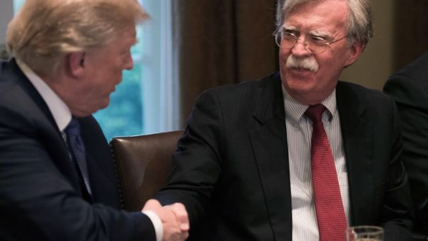 (FILES) In this file photo taken on Apr. 9, 2018 US President Donald Trump shakes hands with National Security Advisor John Bolton during a meeting with senior military leaders at the White House in Washington, DC. Trump has not decided whether or not to scrap the Iran nuclear deal, Bolton said on April 29, 2018. "He has made no decision on the nuclear deal, whether to stay in or get out," Bolton told Fox News Sunday.

(NICHOLAS KAMM / AFP)