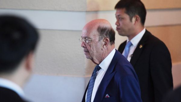 US Commerce Secretary Wilbur Ross (C) walks through a hotel lobby as he heads to the US embassy in Beijing on May 3, 2018. Top US and Chinese officials prepared on May 3 to kick off crucial trade talks in Beijing but both sides sought to dampen expectations for a quick resolution to a heated dispute between the world's two largest economies.
(GREG BAKER / AFP)
