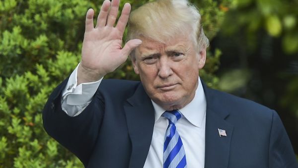 U.S. President Donald Trump waves after he arrived at the White House on May 4, 2018 in Washington, DC. 
(Andrew CABALLERO-REYNOLDS / AFP)