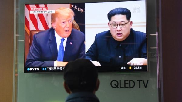 A man watches a television news screen showing US President Donald Trump (L) and North Korean leader Kim Jong Un (R), at a railway station in Seoul on May 25, 2018. US President Donald Trump on May 24 called off his planned June summit with Kim Jong Un, blaming "open hostility" from the North Korean regime and warning Pyongyang against committing any "foolish or reckless acts."
(Jung Yeon-je / AFP)