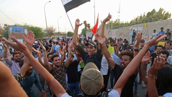 Iraqi men demonstrate in the southern oil-rich city of Basra, the heart of recent protests against power shortages, graft and other social ills, on August 10, 2018. (AFP/ File)