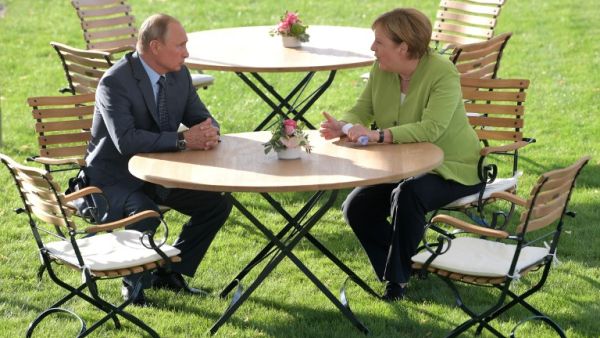 German Chancellor Angela Merkel (R) meets with Russian President Vladimir Putin on August 18, 2018 at Schloss Meseberg castle in Meseberg (AFP)