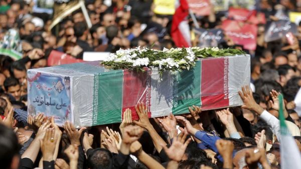 Thousands of people gather in the south-western Iranian city of Ahvaz for the funeral of those killed during an attack on a military parade (AFP)