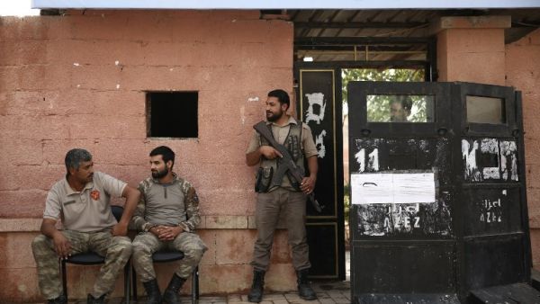 Syrian police stand guard (AFP)