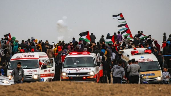 This picture taken on December 7, 2018 shows ambulances parked as Palestinians gather for a demonstration along the border with Israel east of Gaza City. (Said KHATIB / AFP)