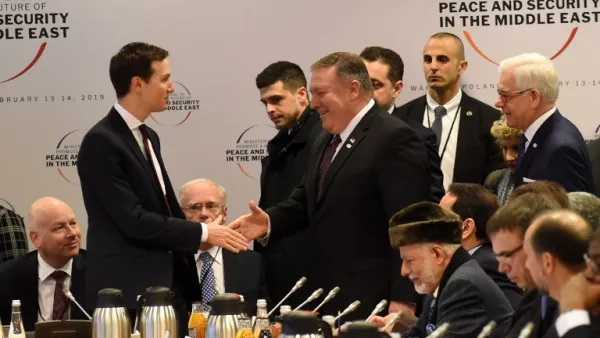 White House US Senior Advisor Jared Kushner (L) shakes hands with US Secretary of State Mike Pompeo as they arrive for a session at the conference on Peace and Security in the Middle east in Warsaw, on February 14, 2019. 
Janek SKARZYNSKI / AFP