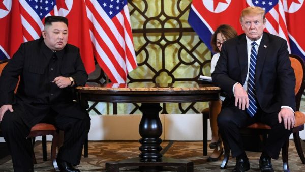 US President Donald Trump (R) and North Korea's leader Kim Jong Un hold a meeting during the second US-North Korea summit at the Sofitel Legend Metropole hotel in Hanoi on February 28, 2019. (AFP)