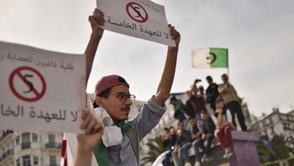 Algerian students hold up banners as they demonstrate in the capital Algiers on March 5, 2019 against their ailing president's bid for a fifth term. (AFP)
