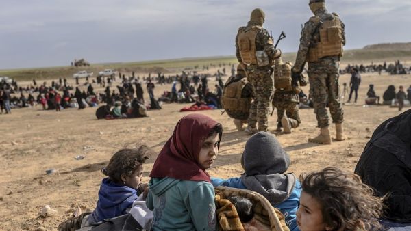 Civilians evacuated from the Islamic State (IS) group's embattled holdout of Baghouz, in the eastern Syrian province of Deir Ezzor. (Bulent KILIC / AFP)