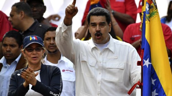 Venezuela's President Nicolas Maduro gestures next to first lady Cilia Flores (L) during a rally at the Miraflores Presidential Palace in Caracas, Venezuela on March 9, 2019. (AFP/ File Photo)