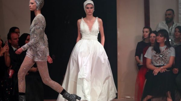 Models present creations by Christian Dior during the Haute Couture Spring-Summer 2019 collection fashion show in the emirate of Dubai on March 18, 2019. 
Karim Sahib / AFP