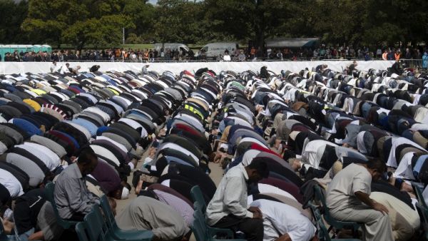 Muslims offer Friday prayer led by Gamal Fouda, imam (lead cleric) of tragedy-stricken Al Noor mosque, during a gathering for prayers and to observe a two minutes of silence for victims of the twin mosques massacres at Hagley Park in Christchurch  (AFP)
