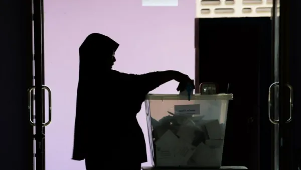 A woman casts her ballot at a polling station in Narathiwat on March 24, 2019 during Thailand's general election. 
(Madaree TOHLALA / AFP)