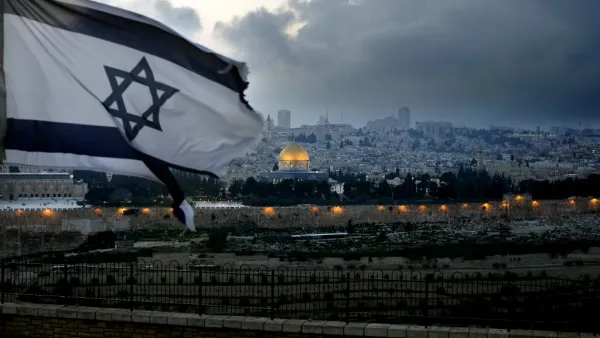 An Israeli flag flutters at Mount of Olives with the Old City of Jerusalem and its Dome of the Rock mosque in the centre, March 27, 2019. (THOMAS COEX / AFP)
