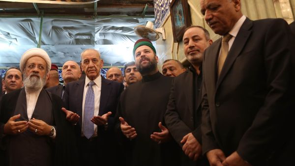 Lebanese Parliament Speaker Nabih Berri (2nd-L) prays at the shrine of Imam al-Abbas in the central Iraqi holy city of Karbala on April 2, 2019. 
Mohammed SAWAF / AFP
