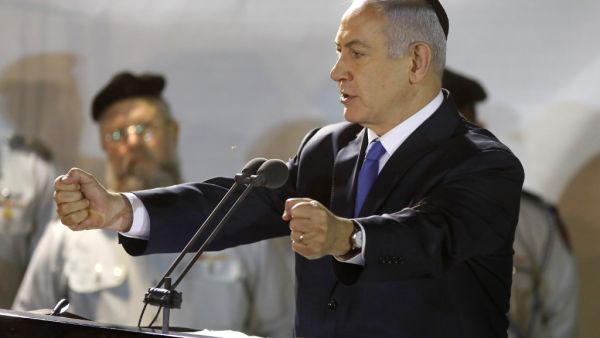 Prime Minister Benjamin Netanyahu (R) attends the funeral of Sergeant First Class Zachary Baumel at the Mount Herzl military cemetery in Jerusalem on April 4 2019. (MENAHEM KAHANA / AFP)