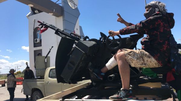 Forces loyal to the internationally recognised Libyan Government of National Accord (GNA) are pictured at the entrance gate leading to Tripoli's old airport on April 8, 2019. (AFP/ File)