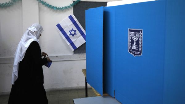 An Arab Israeli woman prepares to cast her vote during Israel's parliamentary elections on April 9, 2019 in Daliyat al-karmel in northern Israel. (Jalaa MAREY / AFP)